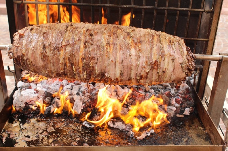 Döner kebab meat skewer made of lamb grilled over fire.